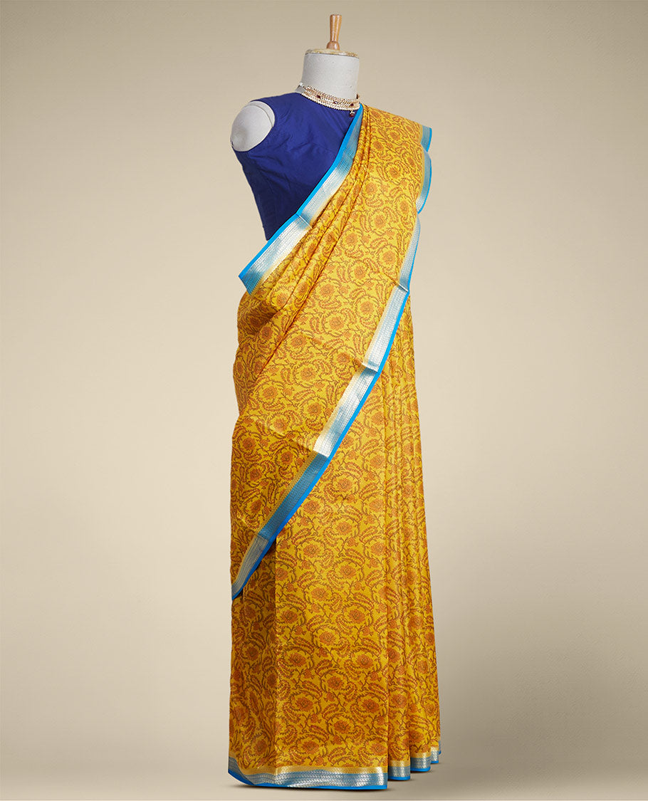 Yellow floral vine design printed silk saree with contrast striped zari border