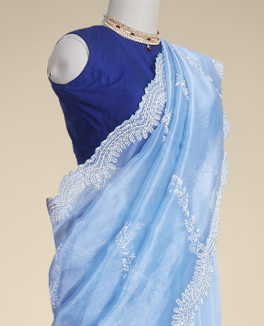 Blue floral emboridery tissue silk saree with scallop floral border