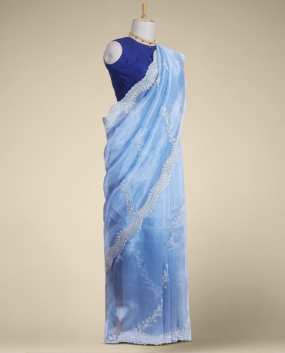 Blue floral emboridery tissue silk saree with scallop floral border
