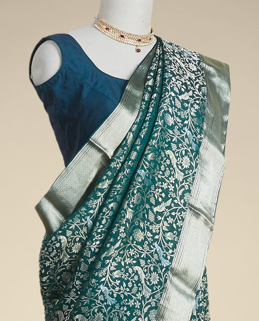 Green floral embroidery pure crepe saree with self intricate zari design border
