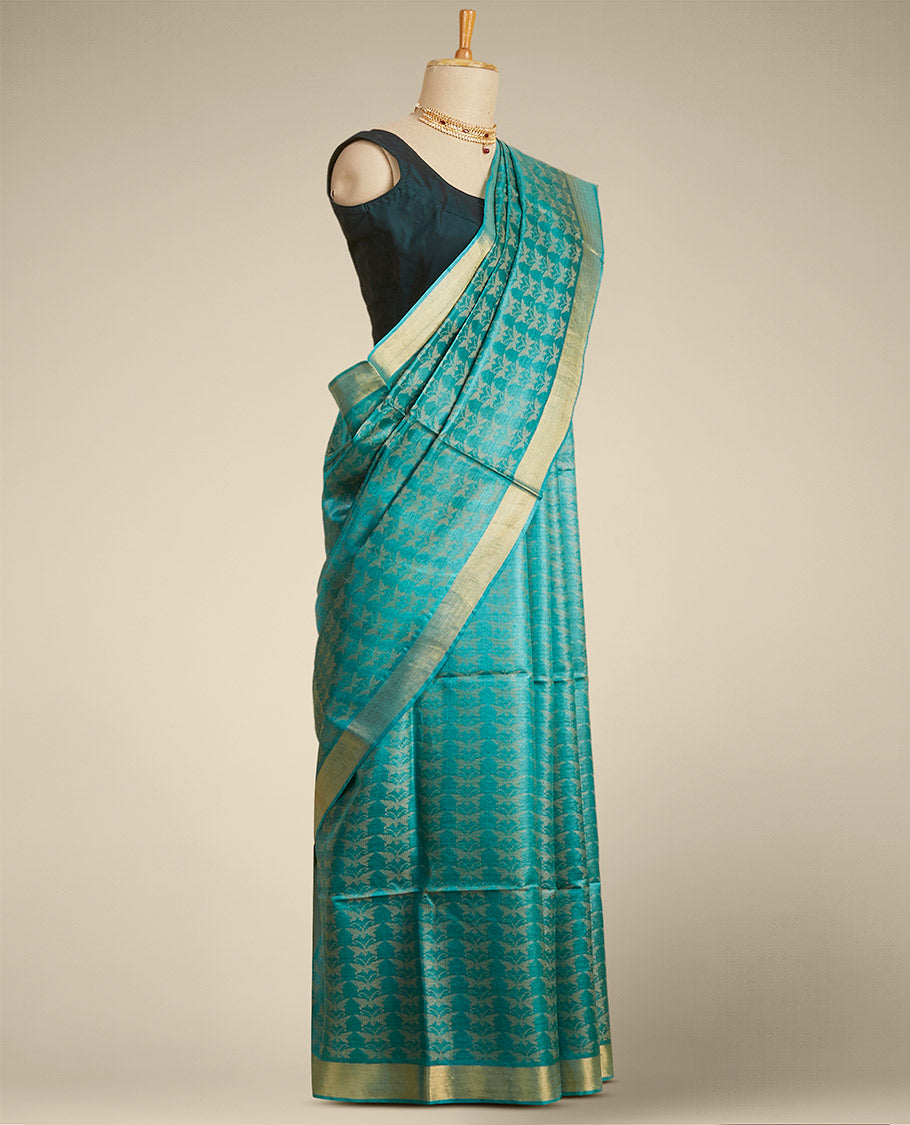 Green  intricate design  tusser silk saree with self zari border