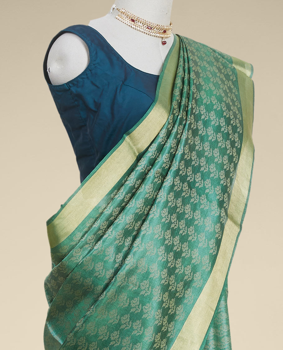 Green floral design tusser silk saree with self zari border