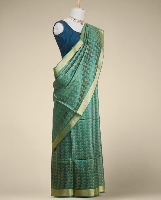 Green floral design tusser silk saree with self zari border