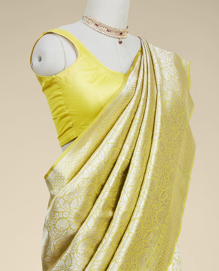 Yellow floral jacquard banaras silk saree with self intricate zari border