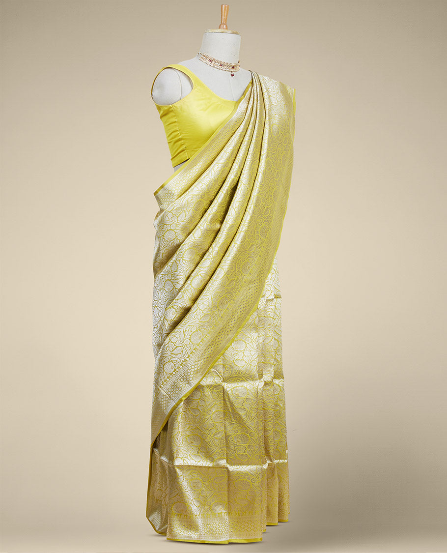 Yellow floral jacquard banaras silk saree with self intricate zari border