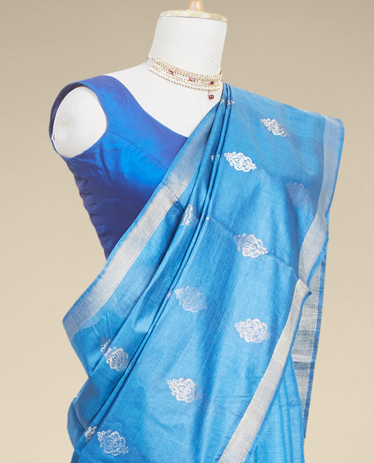 Blue  floral buttas tusser silk saree with self zari border