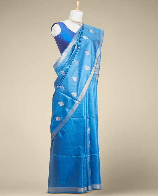 Blue  floral buttas tusser silk saree with self zari border