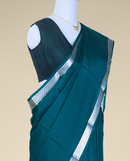 Green plain mysore silk saree with contrast zari design border