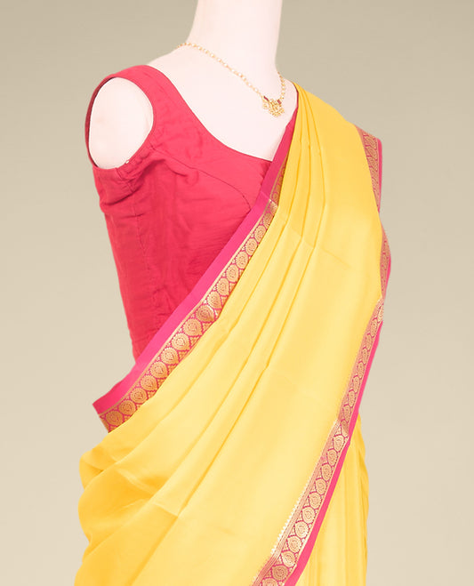 Yellow plain mysore silk saree with contrast zari design border
