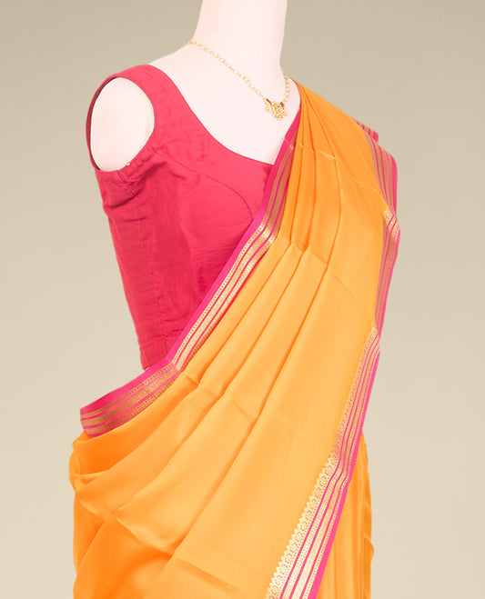 Yellow plain mysore silk saree with contrast zari design border