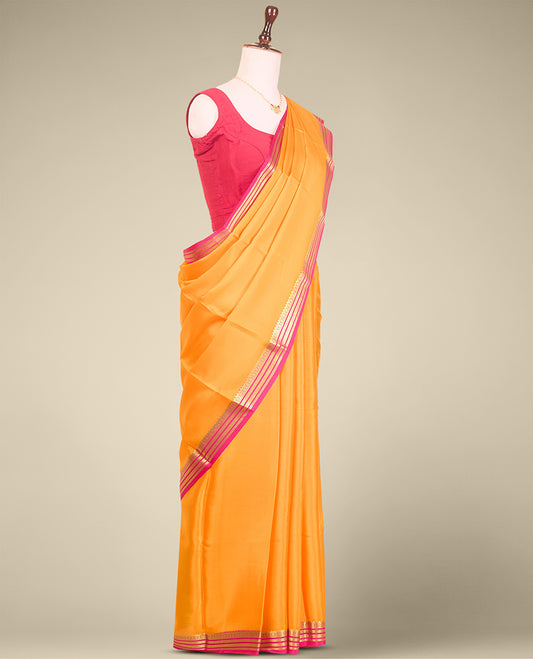 Yellow plain mysore silk saree with contrast zari design border