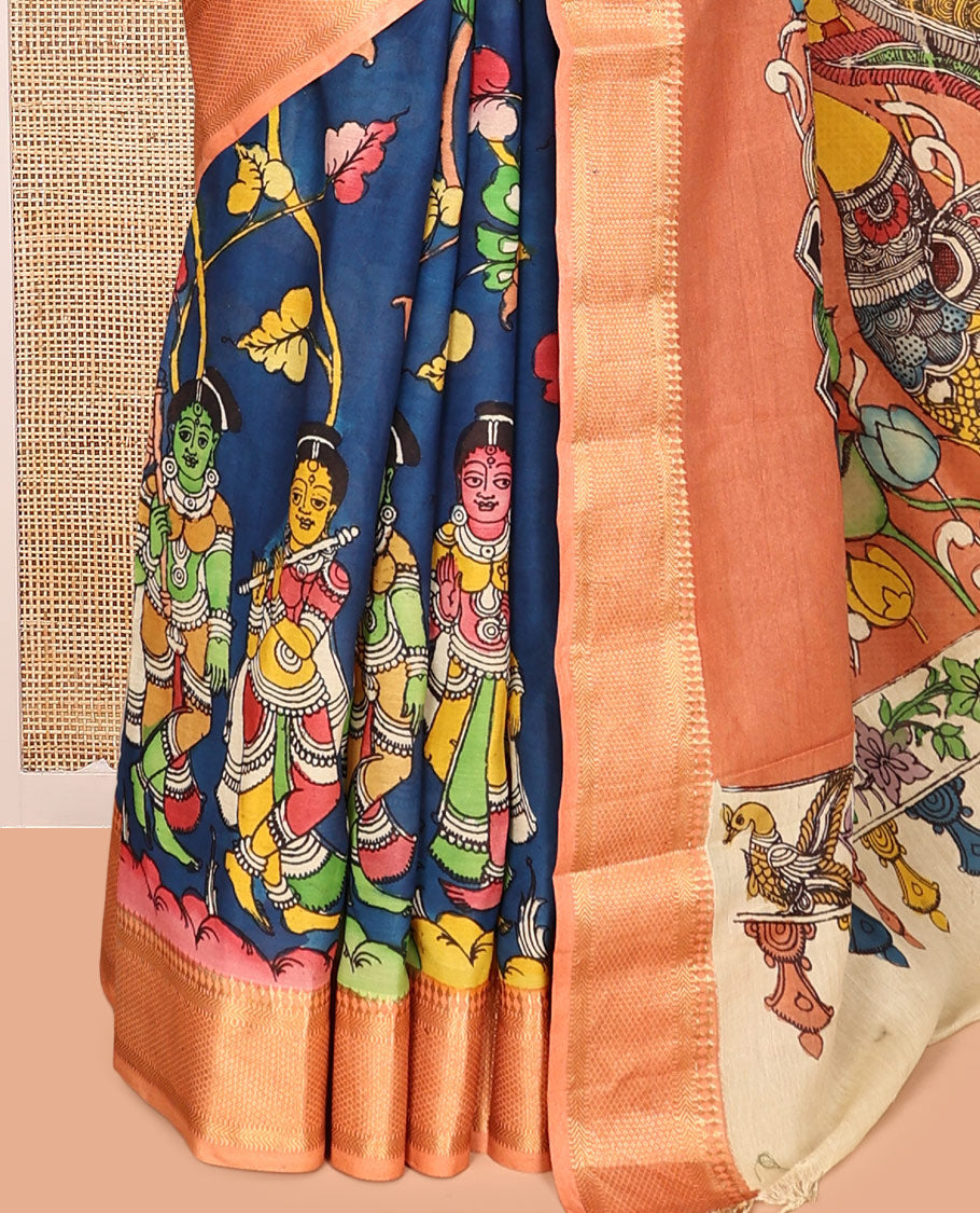 Blue Kalamkari Silk Saree, Opulently Embellished with Floral Vine and Ancient Human Motifs Print, a Contrast Traditional Zari Border, Pallu Features Peacock, and a Contrast Blouse