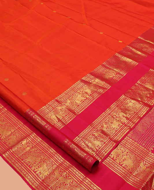 Orange Kanchipuram Silk Saree, Detailed with Zari Buttas, Complemented by Contrast Border of Banaras, Kamalam, and Yaanai Designs, Zari Woven Pallu, and Contrast Blouse