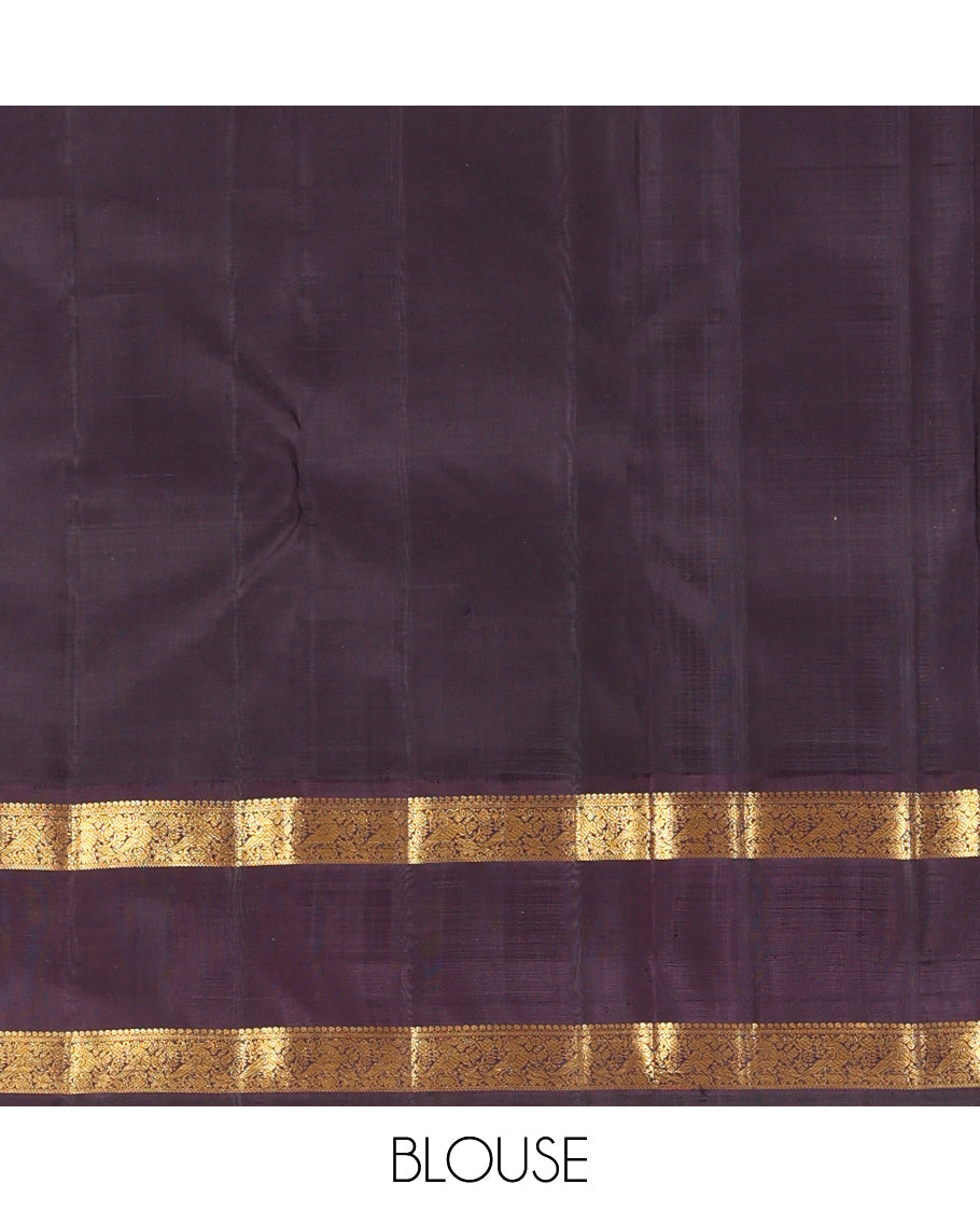 Orange Checked Kanchipuram Silk Saree, Complemented by a Contrast Korvai Rettai Pettu Border of Mayil Designs, Zari Striped Pallu, and a Contrast Blouse
