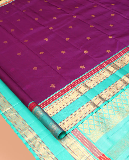 Purple Vasundhara Silk Saree, Accentuated with Zari Buttas, Complemented by a Contrast Border of Muthu, Kathir, and Chakram, Grand Pallu, and a Contrast Blouse
