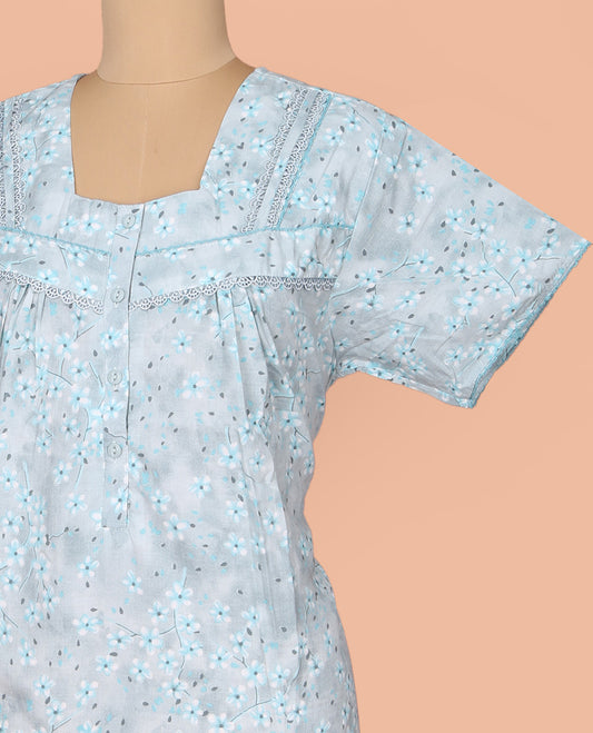 Pale Blue Cotton Nighty Subtly Sparkled with Floral Print, Featuring Lace Work, Square Front Neck, and Half  Sleeves