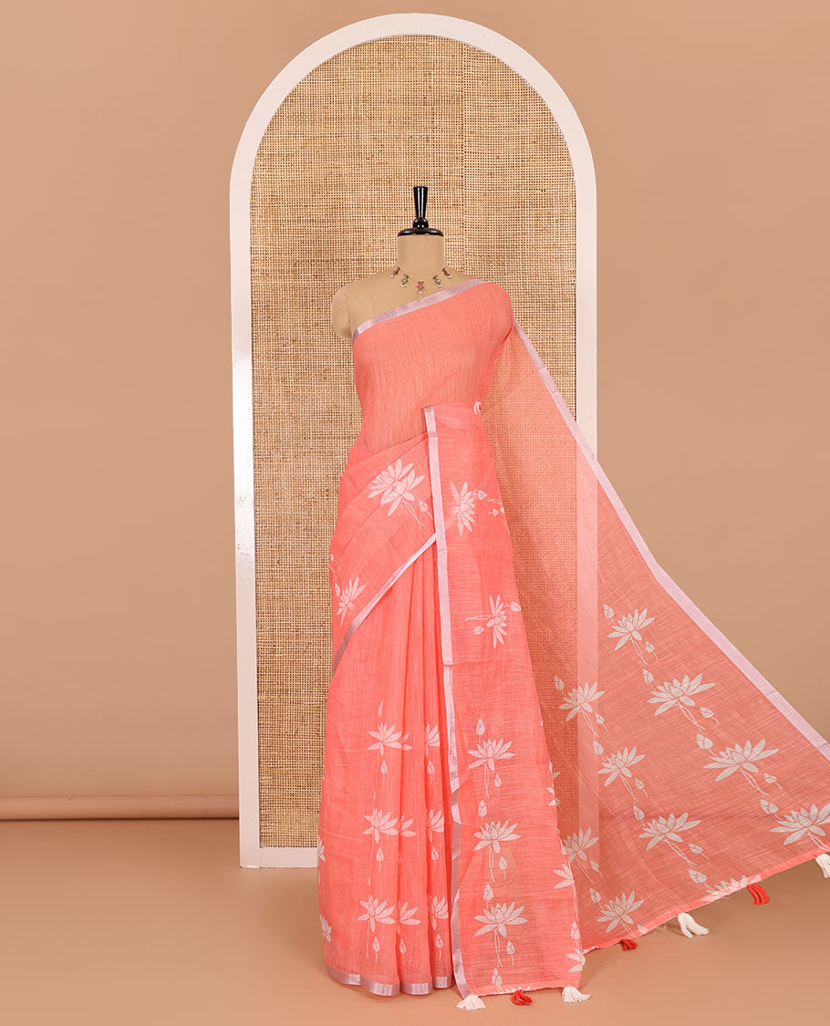 Orange Pichwai lotus printed linen cotton saree, piping zari border, colorful tasselled lotus printed pallu, and a contrast lotus printed blouse