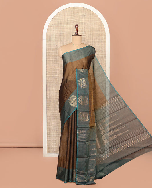 Brown Silk Cotton Saree, Decorated with Buttas All Over Its Body, Complemented by Contrast Border of Parrot Chariot Designs, Temple Pallu, and Paired with a Contrast Blouse