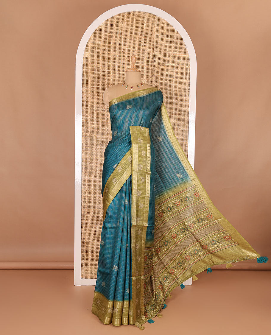 Peacock green zari checked and elephant buttas saree with contrast traditional zari border of elephant print, floral vine printed pallu, and a contrast floral vine printed blouse