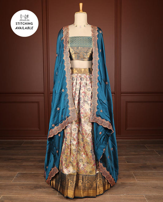 Cream floral vine design half saree with contrast zari design border, zari design blouse & blue floral embroidery scallop border dhavani