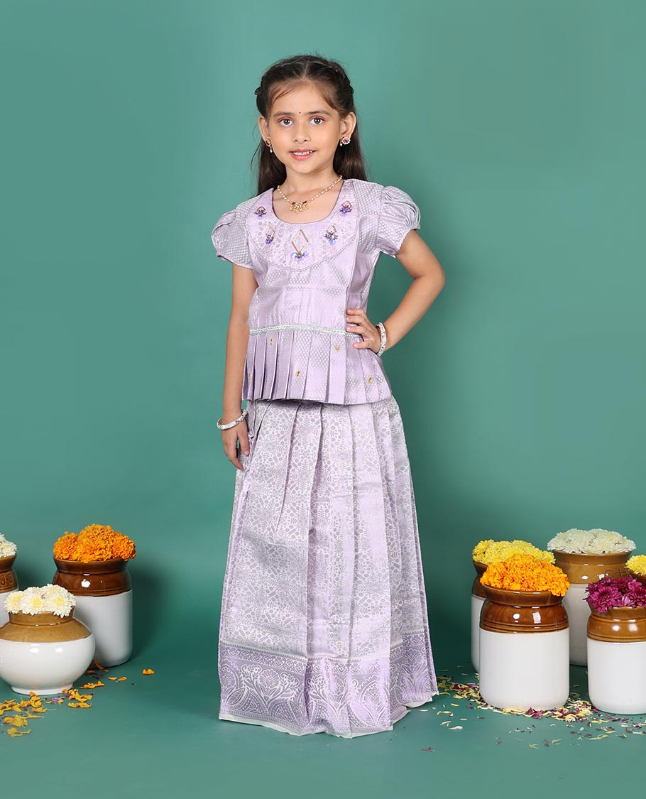 Lavender art silk readymade pavadai set, jacquard with traditional zari border skirt, and jacquard embroidered puff-sleeve blouse