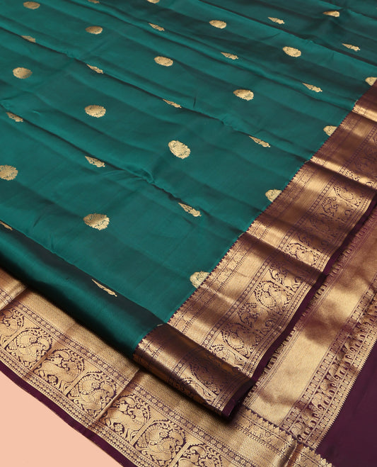 Green Vasundhara Lite Silk Mix Saree, Adorned with Zari Buttas, Contrast Border of Thilakam, Yaanai, Mayil Kann, Muthu, Kamalam, Annam, and Yaali, Jaal Pallu, and a Contrast Blouse