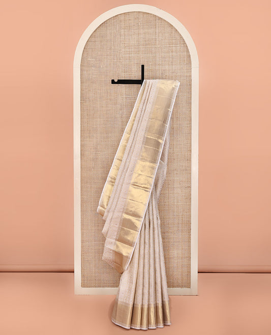 Off-White Kanchipuram Wedding Silk Saree, Finely Woven with Jacquard Design On Its Body, Highlighted by Zari Floral Creeper Design Border, Grand Pallu and Paired with a Matching Blouse