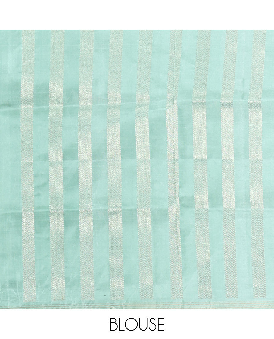 Pale Green Mayuri Soft Silk Saree, Beautifully Bedecked with Kili Buttas, a Subtle Piping Border, Sparsely Woven Pallu, and a Matching Blouse