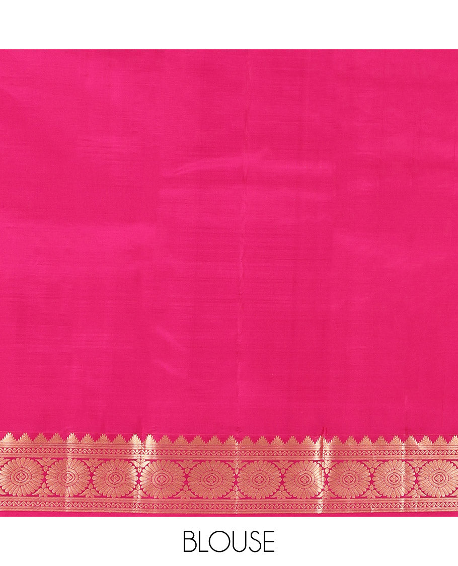 Orange Kanchipuram Silk Saree, Woven with Zari Buttas All Over Its Body, Complemented by a Contrast Border of Thazampoo Rekku, Banaras, Neli, and Chakram Designs, Intricately Designed Pallu, and Paired with a Contrast Blouse