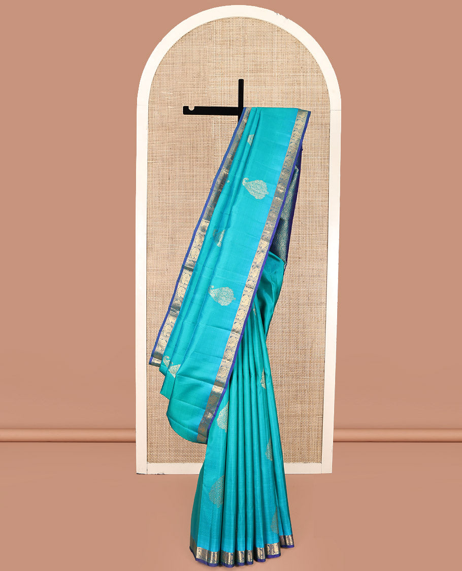 Blue Kanchipuram Silk Saree, Woven with Zari Buttas on Its Body, Complemented by Contrast Border of Annam Designs, Grand Jaal Design Pallu, and Paired with a Contrast Blouse