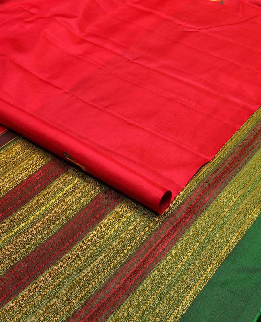 Borderless red parrot buttas kancheepuram silk saree with intricate floral design pallu