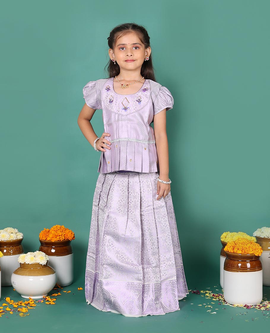 Lavender art silk readymade pavadai set, jacquard with traditional zari border skirt, and jacquard embroidered puff-sleeve blouse