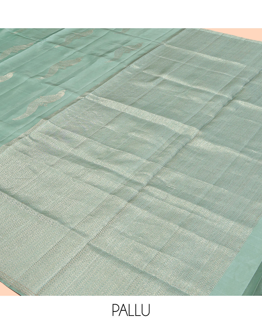 Pale Green Mayuri Soft Silk Saree, Beautifully Bedecked with Kili Buttas, a Subtle Piping Border, Sparsely Woven Pallu, and a Matching Blouse