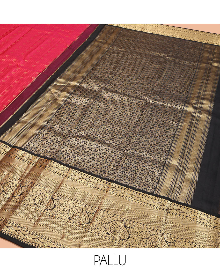 Red Vasundhara Silk Saree, Subtly Sparkled with Buttas and Stripes All Over Its Body, Complemented by Contrast Zari Border of Diamond, Mayil Kann, Manga, and Kodi Visiry Designs, Opulently Embellished Pallu, and Paired with a Contrast Blouse