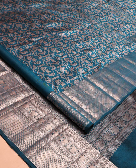 Blue Kanchipuram Wedding Silk Saree, Gracefully Embellished with Jacquard Design on Its Body, Highlighted by Zari Border of Thilakam Mokku, Vanki, Jaal, and Yaali Designs, Grand Jaal Pallu, and Paired with a Matching Blouse