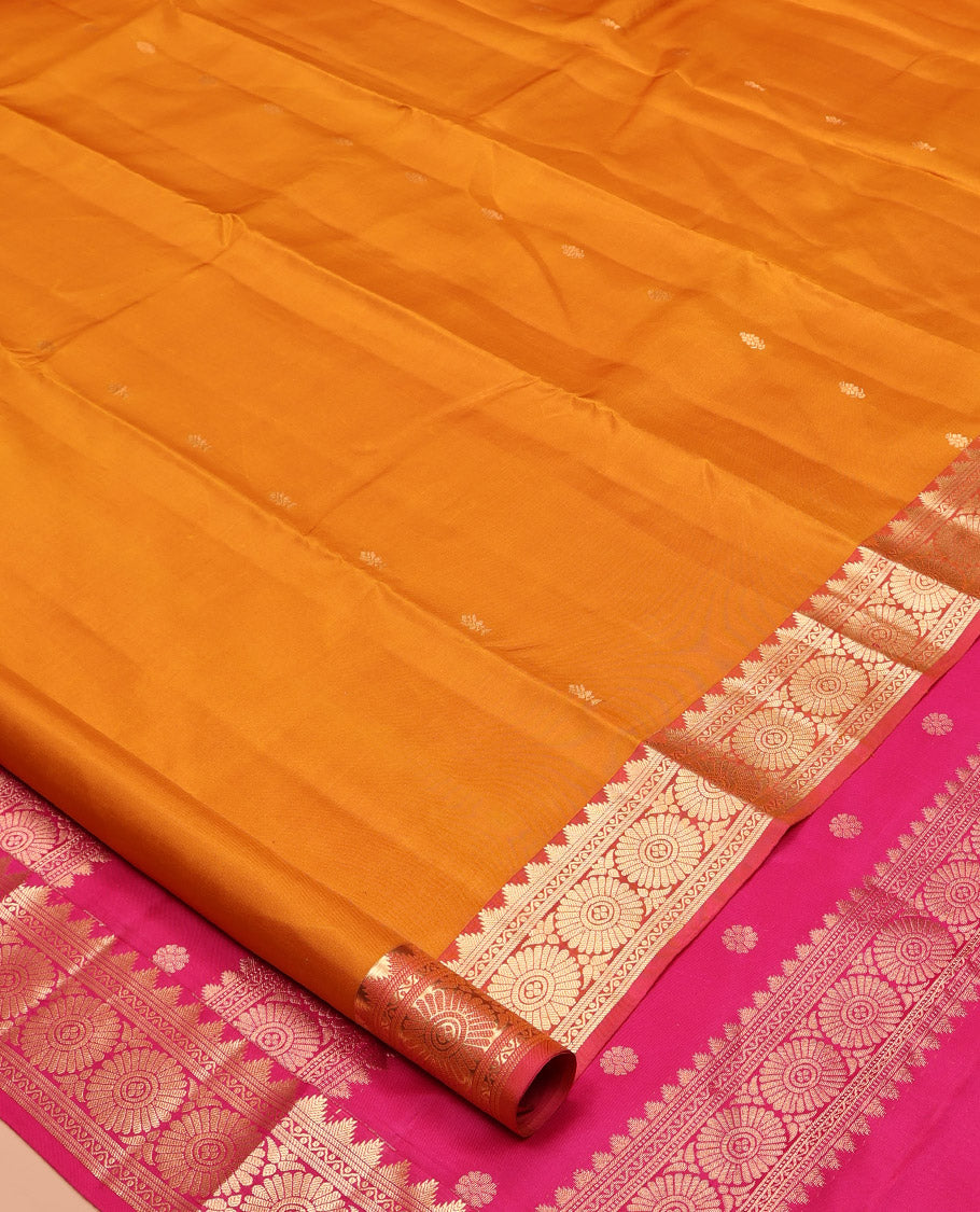 Orange Kanchipuram Silk Saree, Woven with Zari Buttas All Over Its Body, Complemented by a Contrast Border of Thazampoo Rekku, Banaras, Neli, and Chakram Designs, Intricately Designed Pallu, and Paired with a Contrast Blouse