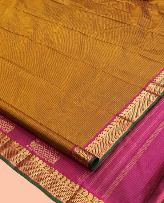 Brown Kanchipuram Silk Saree, Elevated with Vazhaipoo Stipes and Zari Buttas, a Contrast Ara Madam and Manga Motif Border, Pallu of Zari Design, and Contrast Blouse
