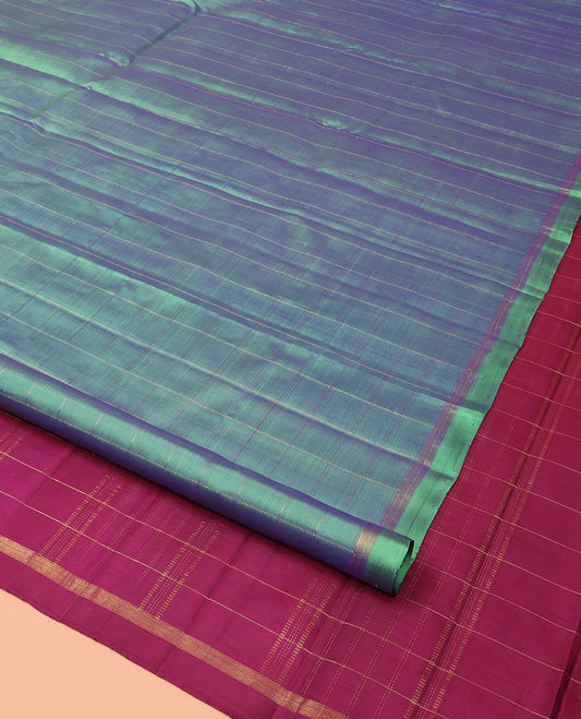 Green Kanchipuram Silk Saree Subtly Sparkled with Stripes, Zari Border, Captivating Contrast Pallu of Zari Stripes, and Paired with a Contrast Zari Striped Blouse