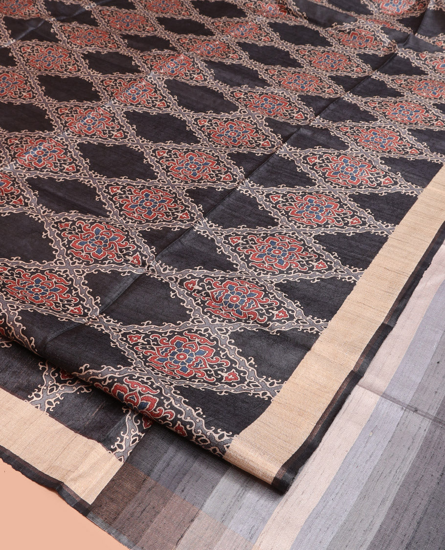 Black Tussar Silk Saree, Artfully Detailed with Ajrakh-Style Jaal Design on Its Body, a Subtle Border, Ombre-Style Striped Pallu, and Paired with a Contrast Blouse