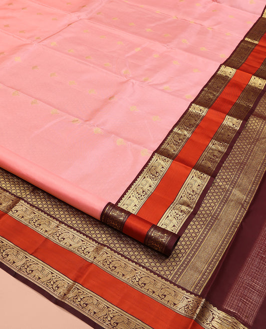 Pink Vasundhara Silk Saree, Sparsely Sparkled with Zari Buttas All Over Its Body, Complemented by a Contrast Rettai Pettu Border of Rekku, Muthu, and Yaanai Designs, Grand Geometric Pallu, and Paired with a Contrast Blouse