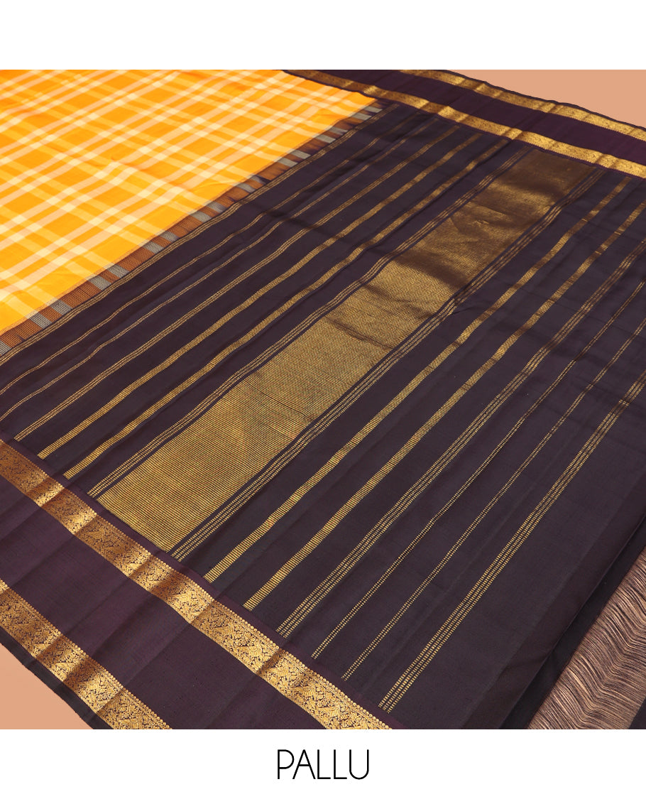 Orange Checked Kanchipuram Silk Saree, Complemented by a Contrast Korvai Rettai Pettu Border of Mayil Designs, Zari Striped Pallu, and a Contrast Blouse