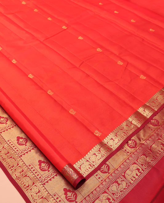 Orange Vasundhara Lite Silk Mix Saree, Gleamed Up with Zari Buttas, a Contrast Border of Manga, Kathir, Mayil, and Yaanai Designs, Grand Pallu, and a Contrast Blouse