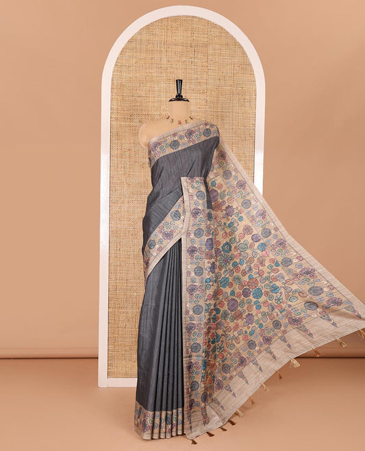 Grey plain fancy tussar saree, contrast floral creeper border, pallu of kalamkari floral vine print, and floral printed blouse