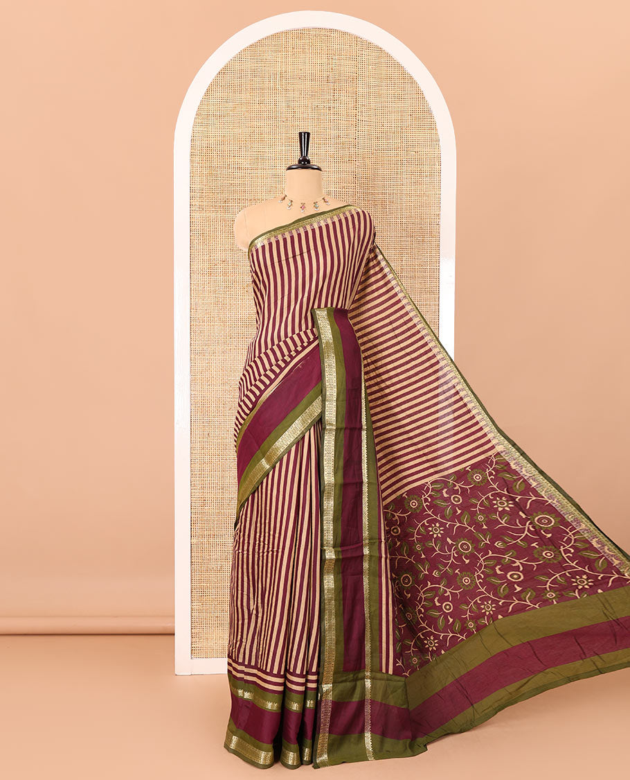 Wine vertically striped muslin silk saree, contrast zari rettai pettu border, kalamkari floral vine printed pallu, and a contrast plain blouse