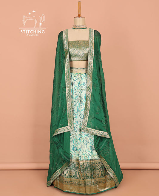 Green ikkat design art silk half saree, contrast traditional design border, jacquard blouse & stone work dhavani