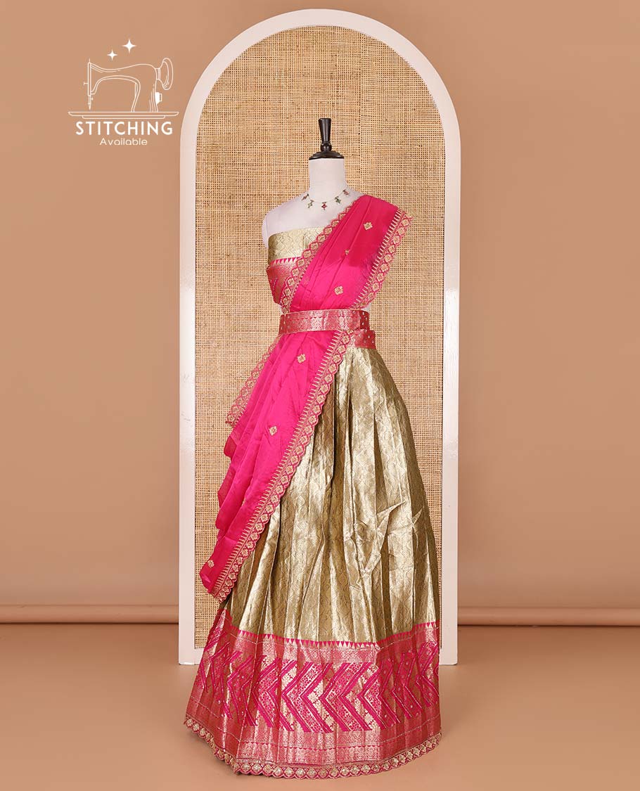 Gold banaras half saree, ogee skirt, contrast rani pink traditional zari border, matching blouse, and Syska georgette embroidered dhavani