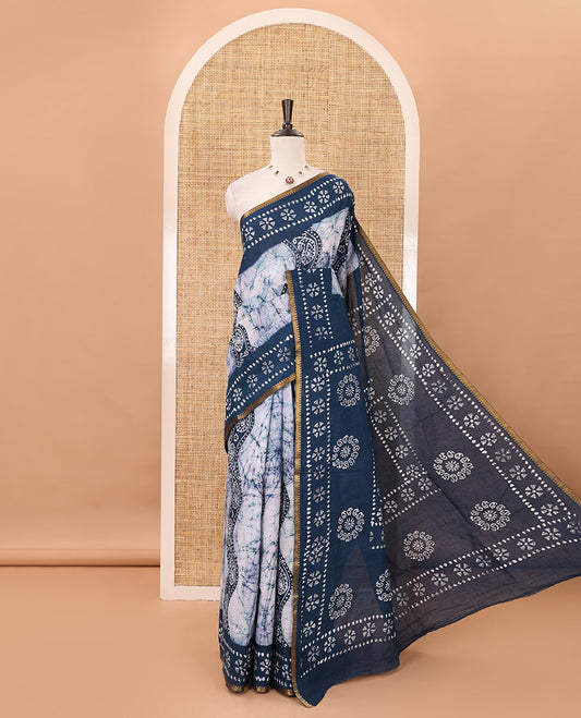 Blue batik-printed sungudi cotton saree, mango zari small border, batik-printed pallu & running blouse