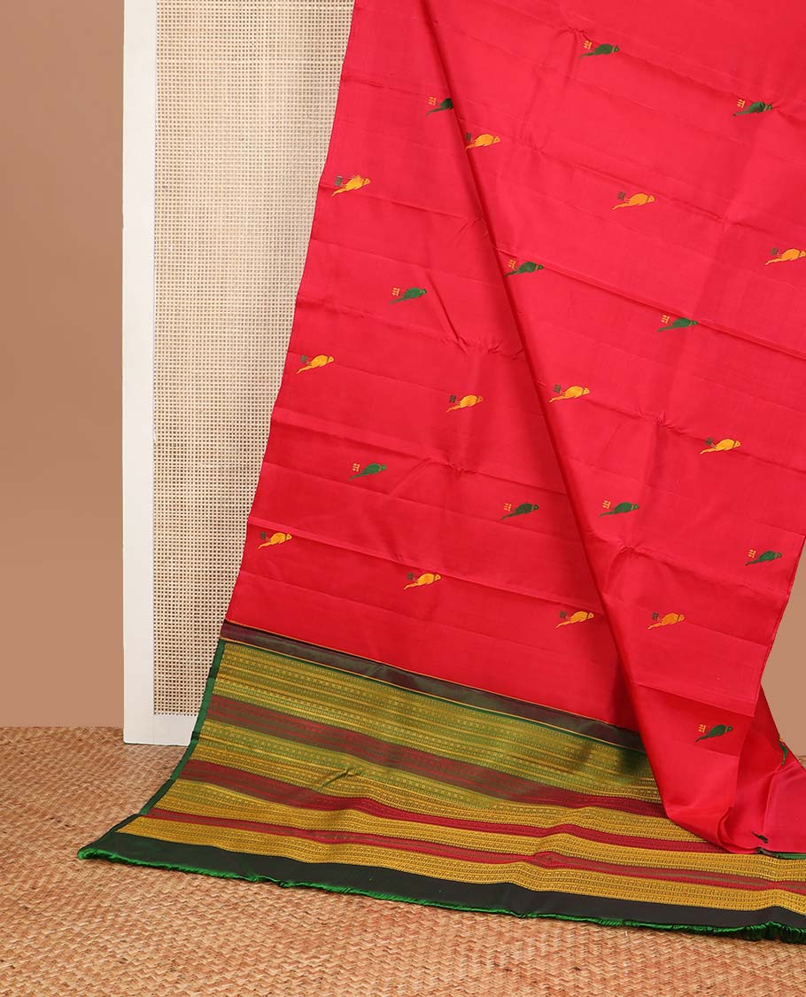 Borderless red parrot buttas kancheepuram silk saree with intricate floral design pallu