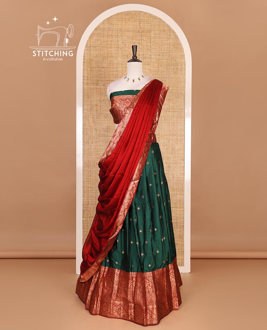 Dark green taffeta silk half saree, zari buttas with contrast red traditional zari border, matching zari blouse, and contrast plain zari border dhavani