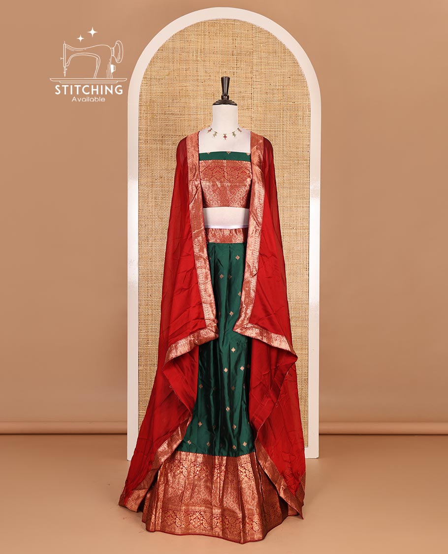 Dark green taffeta silk half saree, zari buttas with contrast red traditional zari border, matching zari blouse, and contrast plain zari border dhavani